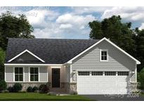 One-story home with gray siding, stone accents, and a two-car garage at 147 Commerce Blvd # 0003, Lancaster, SC 29720