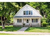 Charming two-story home features a well-maintained lawn and inviting front porch at 610 4Th St, Spencer, NC 28159