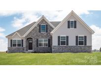 Charming home with a stone facade, gray siding, and a well-manicured lawn at Lot 51 Watercourse Way # Arcadia, Belmont, NC 28012