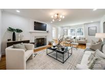 Bright living room with hardwood floors, fireplace, and stylish furnishings at 1081 Evergreen Cir, Rock Hill, SC 29732