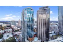 Stunning high-rise boasts modern architecture, a refreshing rooftop pool, and city views at 210 N Church St # 2702, Charlotte, NC 28202