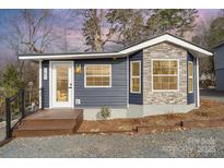 Charming craftsman style home with stone accents and a modern deck at 151 Dogwood Cir, New London, NC 28127