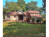 Charming two-story home with a well-maintained front yard and a combination of brick and siding accents at 16425 Grapperhall Dr, Huntersville, NC 28078