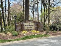 Stone Waterford Point community sign surrounded by manicured landscaping and mature trees at 21315 Blakely Shores Dr, Cornelius, NC 28031