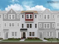 Three-story townhome with red accents and a gray exterior at 4064 Skyboat Cir, Fort Mill, SC 29715