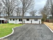 Charming single-story home with a well-maintained front yard and a spacious driveway at 529 Catalina Dr, Albemarle, NC 28001