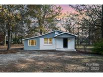 Newly renovated house with gray siding and white accents at 129 Doster Rd, Lancaster, SC 29720