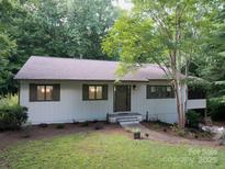 Charming single-story home featuring a landscaped front yard and inviting entrance at 317 Belwood Dr, Belmont, NC 28012