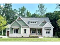 Charming craftsman home featuring white brick, green siding, and a well-manicured lawn at 959 Tamary Way # 29/30, Landis, NC 28088