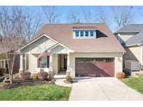 Craftsman style home with two-car garage and landscaped front yard at 136 Chimney Rock Ct, Denver, NC 28037