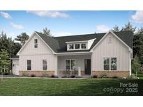 Craftsman style home with gray roof, white siding, and brick accents at 631 Short Stroll Ct # 33, Clover, SC 29710
