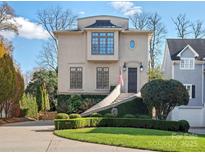 Charming home featuring unique architecture, manicured landscaping, and inviting curb appeal at 1655 Scotland Ave, Charlotte, NC 28207