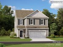 Two-story house with gray siding, two-car garage, and landscaping at 1808 Otter Perch Ln, Fort Mill, SC 29715
