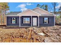 Charming single-story home with navy siding, black shutters, and covered porch at 872 Old Mocksville Rd # 1, Statesville, NC 28625