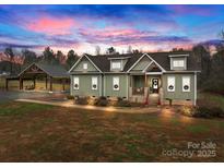 Charming craftsman-style home with inviting front porch and lush, landscaped yard at 170 Stillwater Rd, Richfield, NC 28137
