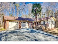 Ranch home with two-car garage and mature trees at 3116 Old Montgomery Place Rd, Monroe, NC 28112