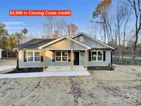 Gray siding one-story house with a front porch at 1308 Carmel Rd, Lancaster, SC 29720