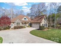Stunning home with stone accents, well-manicured lawn, and inviting curb appeal at 404 Yorkfield Dr, Shelby, NC 28150