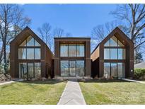 Stunning modern home featuring a unique multi-unit design and expansive windows for natural light at 4026 Chevington Rd # 102, Charlotte, NC 28226