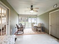 Bright sunroom with wicker furniture and dining set, perfect for relaxation at 2430 Lazy Oak Dr, Lancaster, SC 29720