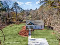 Charming one-story home with a spacious front yard and inviting entrance in a natural setting at 2503 Parnell Dr, Shelby, NC 28150