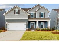 Two-story house with gray siding, two-car garage, and manicured lawn at 2078 Van Buren Rd, Sherrills Ford, NC 28673