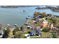 Stunning aerial view of waterfront home with private dock and scenic lake views at 5056 Bridge Way, Denver, NC 28037