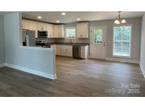 Bright kitchen features stainless appliances, granite counters, and a convenient layout at 702 Park Ave, Salisbury, NC 28144