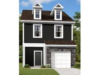 Two-story dark gray house with white accents, stone garage, and dormer windows at 4031 Lawnview Dr, Charlotte, NC 28269