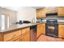 Kitchen with granite countertops and stainless steel appliances at 3706 Selwyn Farms Ln # 17-3, Charlotte, NC 28209