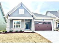Gray Craftsman style home with stone accents and a 2-car garage at 2971 Alveston Nw Dr # 29, Concord, NC 28027