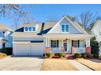 Charming two-story house with brick accents and a two-car garage at 5734 Morris Hunt Dr, Fort Mill, SC 29708