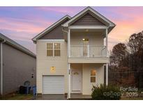 Two-story house with a neutral color scheme and a balcony at 119 Lookout Point Pl, Mooresville, NC 28115