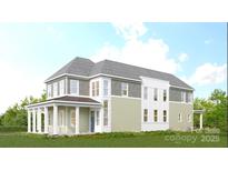 New two-story home with a welcoming front porch, gray roof, and light green siding, showcasing modern curb appeal at 7392 Deer Hollow Rd # 27, Sherrills Ford, NC 28673