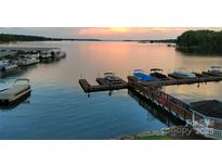 Dock with multiple boat slips at sunset at 7831 Spinnaker Bay Dr # 314, Sherrills Ford, NC 28673