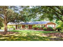 Charming brick home featuring a well-maintained lawn, inviting curb appeal, and a classic architectural design at 829 Rawlinson Rd, Rock Hill, SC 29732