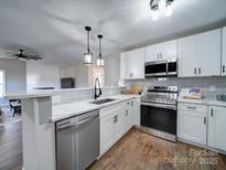 Modern kitchen featuring stainless steel appliances and white shaker cabinets at 131 Nantz Ave, Mount Holly, NC 28120