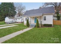 Charming house with front yard, walkway, and driveway at 309 S Ransom St, Gastonia, NC 28052