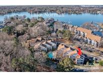 Aerial view of lakefront property with community pool and boat slips at 751 Southwest Dr, Davidson, NC 28036