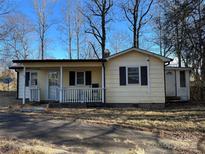 Ranch style home with a covered porch and satellite dish at 3798 Providence Mill Rd, Maiden, NC 28650