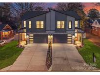 Modern duplex with two-car garages, and landscaped front yards at 520 Stegall St, Charlotte, NC 28217