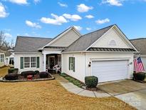 Craftsman style home with a two-car garage and landscaped yard at 15175 Legend Oaks Ct, Fort Mill, SC 29707