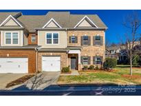 Brick front exterior of charming townhome with 2-car garage at 5110 Pansley Dr, Charlotte, NC 28226