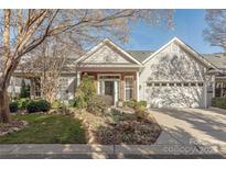 Inviting ranch home with brick accents and a two-car garage at 12117 Frogs Leap Ct, Charlotte, NC 28277