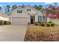 Craftsman style home with neutral siding, two-car garage, and manicured landscaping at 2491 Seagull Dr, Denver, NC 28037