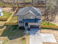 Beautiful exterior of a two-story home with a well-maintained lawn and a two-car garage at 1304 Pleasant Plains Rd, Matthews, NC 28105