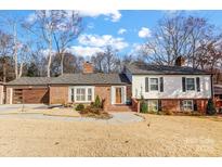 Brick ranch home with updated exterior and landscaping at 3335 Knob Hill Ct, Charlotte, NC 28210