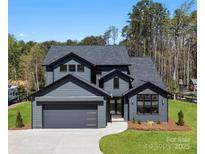 Stunning two-story home with a modern design, attached garage, and lush green lawn at 8039 Mcconnell Rd, Denver, NC 28037