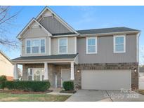 Two-story house with gray siding, brick accents, and a two-car garage at 188 Water Ski Dr # 91, Statesville, NC 28677