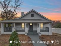 Charming renovated home with a welcoming front porch at 221 Palmer St, Albemarle, NC 28001